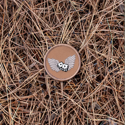 Winged dice iron-on scout patch